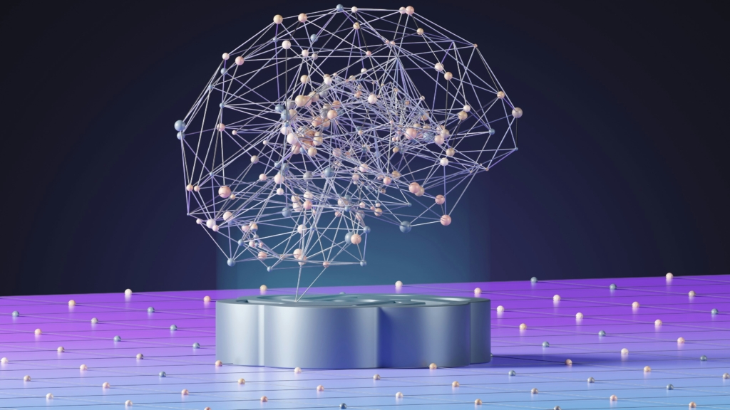 Recreación de un cerebro hecho por líneas transparentes sobre un pequeño pedestal, emulando una especie de cerebro digital.